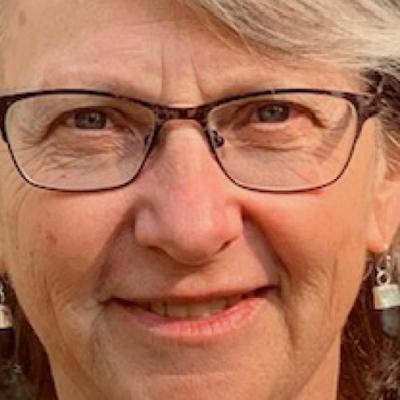 Close-up of Dr. Drance smiling.