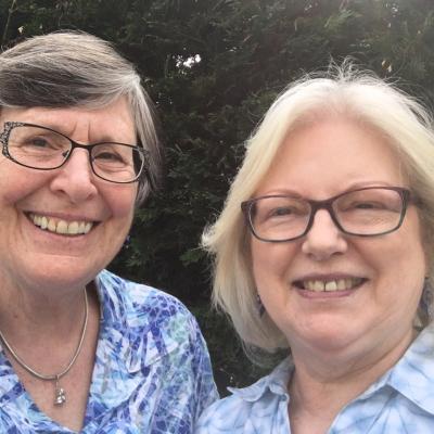 Linda and Ruth smiling and posing for a photo.